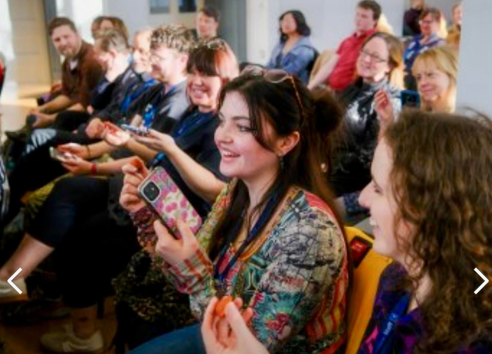 An audience laughing during one of Shane Dean's hope, meaning and happiness TONIC! Talks